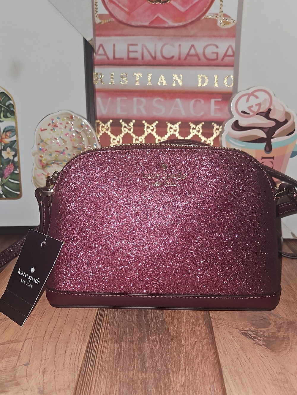 Kate Spade New York Tinsel Small Dome Crossbody in the color Deep Berry